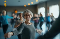 A smiling senior woman dancing at the gym seniors active happy.