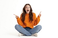 Young woman sitting background pointing excited.