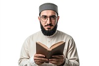 Muslim man holding book background reading glasses.