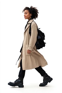 Young mixed race woman walking street coat.