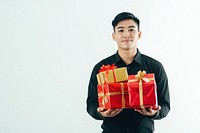 A thai man carry christmas gifts background holiday white.