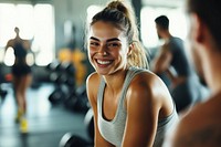 Woman doing a workout in a gym smiling person happy.