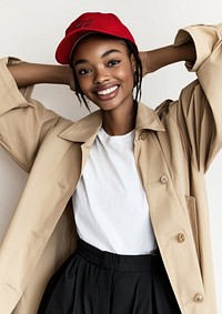 The model wearing a beige trench coat woman smiling happy.