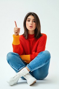 Indian young woman sit on the floor with one thumb finger point to copyspace expression background sitting.