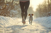 Woman legs with dog jogging exercise running winter.