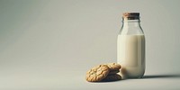 Bottle on the table milk background cookies.