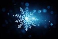 Snowflakes sparkle light glitter background blue art.