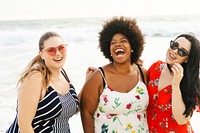 Diverse women friends enjoy beach in summer holidays. Diverse plus size women laugh and smile in summer dresses at beach. Plus size women at the beach, diverse group of happy friends laugh and smile