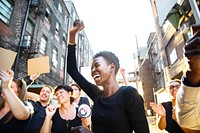 African American black woman celebrate with diverse group of people in a protest. Black woman raise fist celebrate protest. Diverse group of people protesting and celebrating black lives matter