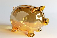 Glass piggy bank gold investment currency.