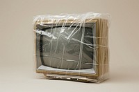 Plastic wrapping over TV television electronics technology.