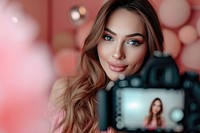 A girl take a selfie with video recording in front portrait adult photo.