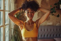 An afican american girl recording her workout at home adult undergarment exercising.