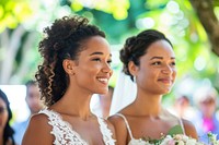 African american woman and hispanic woman getting married wedding bridesmaid outdoors.