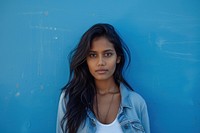 Indian american woman blue casual clothing contemplation.