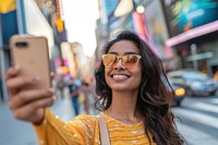 Indian american woman selfie glasses smile.