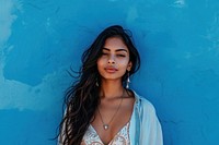 Indian woman adult blue wall.