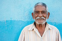 Senior indian american man adult wall blue.