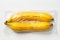 Plastic wrapping over rotten banana plant food white background.