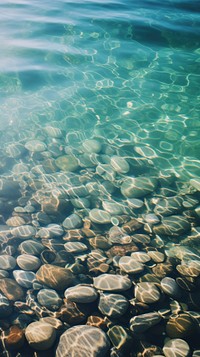  Gravel under the clear water underwater outdoors nature. AI generated Image by rawpixel.