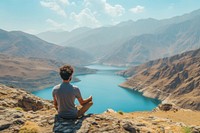 Traveler Middle eastern Man relaxing lake landscape mountain.