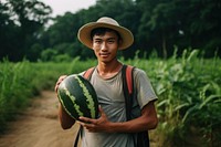 Young Thai man melon watermelon holding.