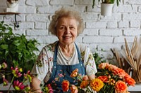 Senior woman florist adult plant entrepreneur.