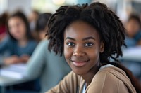 Black female student having an exam looking adult smile.