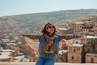 Happy Middle eastern girl traveler on the viewing outdoors nature scarf.