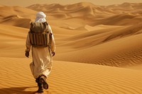 Middle eastern Explorer walking desert outdoors.