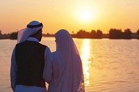 Young wealthy middle eastern couple standing outdoors wedding.