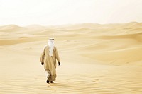 Middle Eastern Man walking desert outdoors.