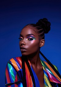 A black teenage woman with colorful makeup photography portrait fashion.