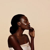 A black woman left hand apply a little bit of cream on her skin photography portrait fashion.