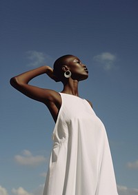 A black woman wearing minimal white dress fashion photography portrait.