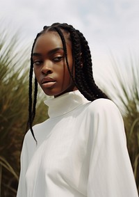 A black woman wearing white modern minimal cloth fashion braid adult.