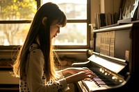 Japanese high school woman piano keyboard musician.