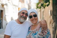 Middle eastern senior couple portrait sunglasses outdoors.