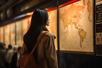  Thai woman looking the big maps in on the wall in subway adult architecture illuminated. AI generated Image by rawpixel.