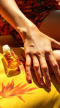  Woman applying Tan oil on her skin sunbathing finger cosmetics bottle. AI generated Image by rawpixel.