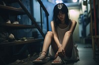 Girl sitting on landing floor footwear worried shoe. AI generated Image by rawpixel.