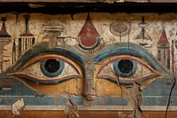 Eye hieroglyphic carvings painting wall architecture.