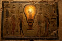 Light bulb hieroglyphic carvings painting ancient wall.