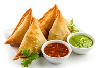 Vegetarian samosas filled with potato and green pea served with different sauces food meal dip.