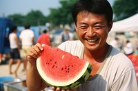 East Asian with Watermelon festival watermelon outdoors adult. AI generated Image by rawpixel.