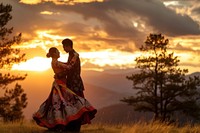 Bhutanese couple dancing outdoors wedding nature.