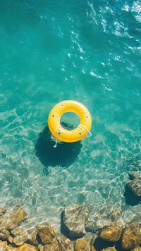 Yellow inflatable ring in the ocean underwater outdoors nature.