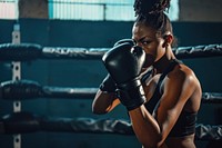 African American woman boxing punching sports.