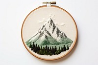 Mountain in embroidery style mountain pattern representation.
