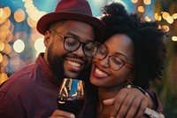 Happy black couple celebrating portrait embracing laughing.
